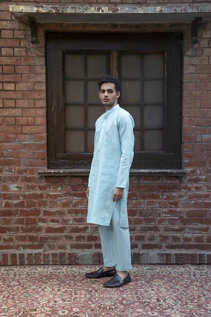 The Kurta-Trouser Suit
Short Kurta, cut above the knee, paired with the Straight-leg Trouser. This signature Kurta Trouser is crafted from 100% fine Cotton
with a silhouette that is a combination of modern-day panache and classic refinement.